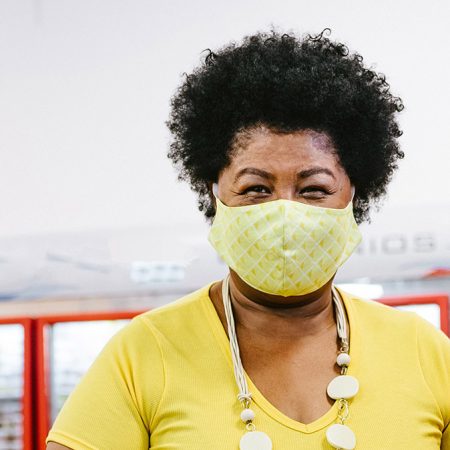 Covid-19: Smiling woman during grocery shopping